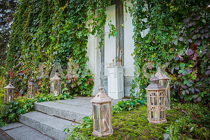 wedding decorations on the street, outdoor - love out of time theme - vintage Vintage wooden lantern with the candle and moss on the background