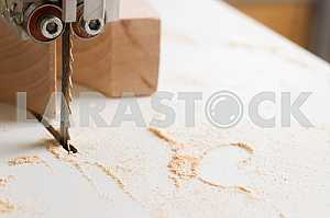 Carpenter tools on wooden table with sawdust. Circular Saw. Carpenter workplace top view