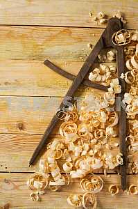 Carpenter tools on wooden table with sawdust. Circular Saw.