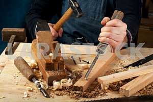 Carpenter tools on wooden table with sawdust. Circular Saw.