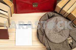 Stack of hardback books on wooden table. Back to school. Copy space. Top view