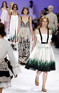 The model demonstrates outfit by Ukrainian designer Larisa Lobanova