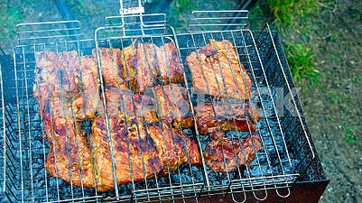 The process of cooking meat on the grill
