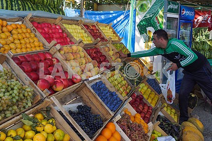 The buyer at a roadside fruit market.