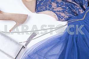 Woman clothes and accessories. Soft blue colors female apparel.