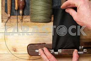 Carpenter tools on wooden table with sawdust. Circular Saw.