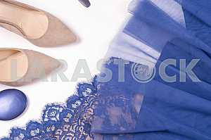 Woman clothes and accessories. Soft blue colors female apparel.