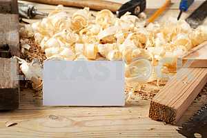 Carpenter tools on wooden table with sawdust. Circular Saw.