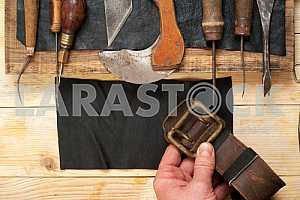 Carpenter tools on wooden table with sawdust. Circular Saw.