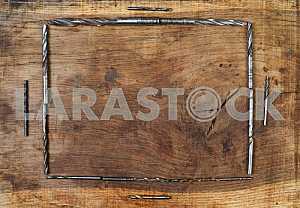Different construction tools on a wooden background - screwdriver, caliper.