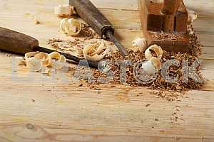 Carpenter tools on wooden table with sawdust. Circular Saw.