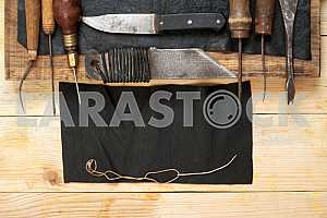 Carpenter tools on wooden table with sawdust. Circular Saw.