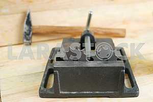Different construction tools on a wooden background - screwdriver, caliper.
