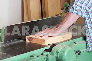 Carpenter tools on wooden table with sawdust. Circular Saw. Carpenter workplace top view