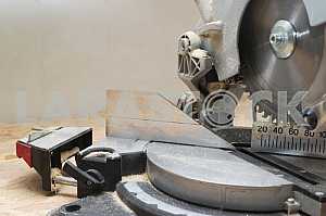 Carpenter tools on wooden table with sawdust. Circular Saw.