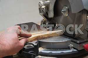 Carpenter tools on wooden table with sawdust. Circular Saw.