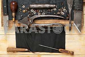 Carpenter tools on wooden table with sawdust. Circular Saw.