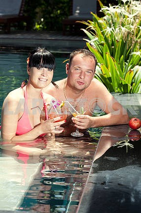 Young loving couple in pool