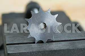 Different construction tools on a wooden background - screwdriver, caliper.