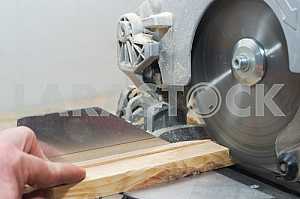 Carpenter tools on wooden table with sawdust. Circular Saw.
