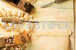 Carpenter tools on wooden table with sawdust. Circular Saw.