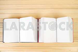 Stack of hardback books on wooden table. Back to school. Copy space