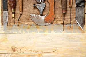Carpenter tools on wooden table with sawdust. Circular Saw.