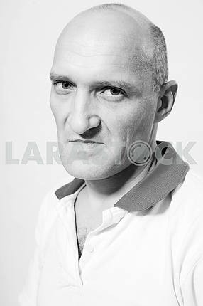 Portrait of the man indignation. Bald
