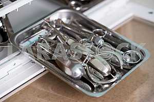 Stomatological instrument in the dentists clinic. Operation, tooth replacement.