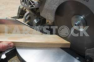 Carpenter tools on wooden table with sawdust. Circular Saw.