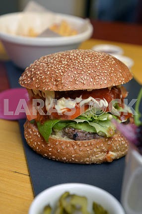 Burger with lettuce leaves