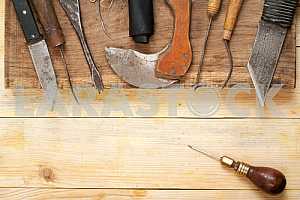 Carpenter tools on wooden table with sawdust. Circular Saw.
