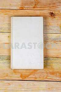 Open book, stack of hardback books on wooden table. Back to school. Copy space