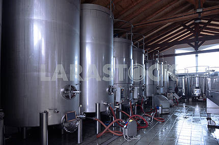 Stainless steel wine vats in a row