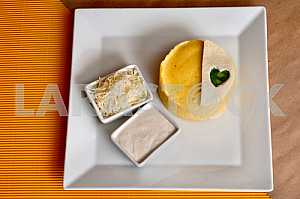 Banush - traditional ukrainian corn dish with cottage cheese and sour cream.