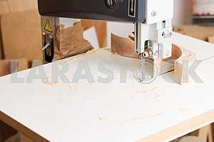 Carpenter tools on wooden table with sawdust. Circular Saw. Carpenter workplace top view