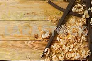 Carpenter tools on wooden table with sawdust. Circular Saw.
