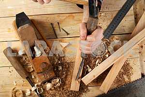 Carpenter tools on wooden table with sawdust. Circular Saw.