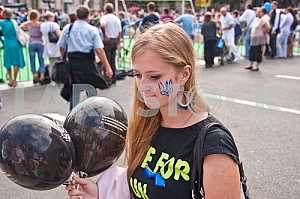 The girl with the symbols on the face and balls.