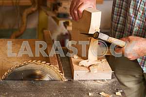 Carpenter tools on wooden table with sawdust. Circular Saw. Carpenter workplace top view