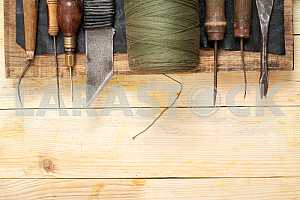 Carpenter tools on wooden table with sawdust. Circular Saw.