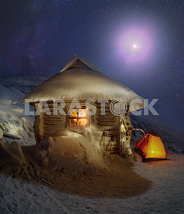 Tents and shelter under a full moon