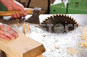 Carpenter tools on wooden table with sawdust. Circular Saw. Carpenter workplace top view