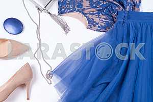 Woman clothes and accessories. Soft blue colors female apparel.