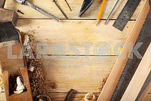 Carpenter tools on wooden table with sawdust. Circular Saw.