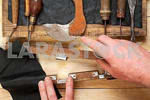 Carpenter tools on wooden table with sawdust. Circular Saw.