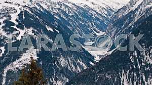 View from the top of the mountain lake in the valley