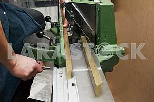 Different construction tools on a wooden background - screwdriver, caliper.