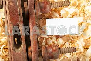 Carpenter tools on wooden table with sawdust. Circular Saw.