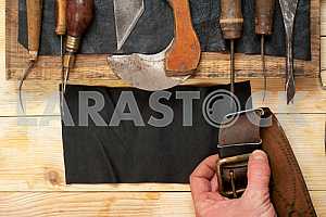 Carpenter tools on wooden table with sawdust. Circular Saw.
